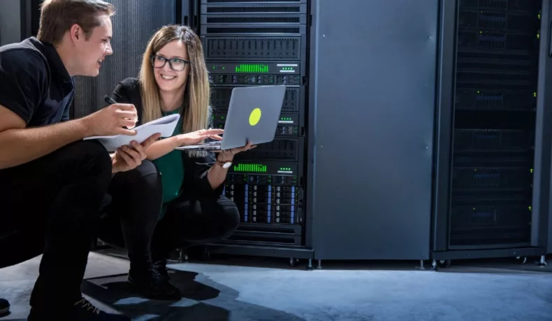 IT experts man and woman happy working on an IT project