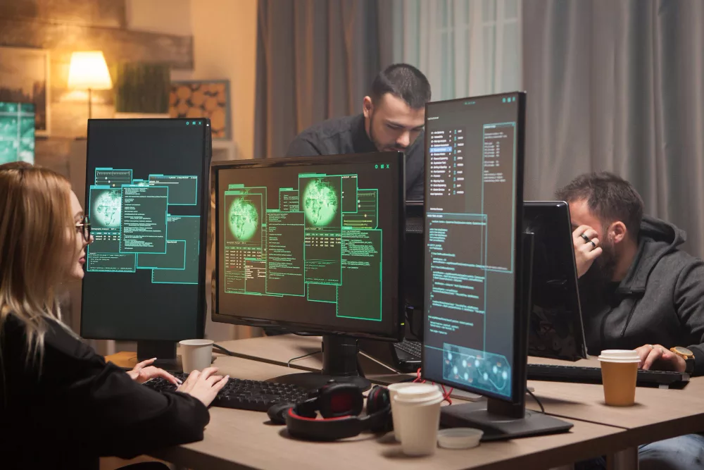 Female hacker with her team hacking government system